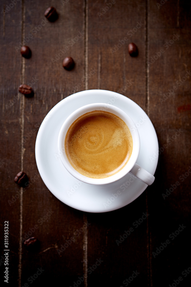 Cup of coffee on rustic wooden background. Top view. Cup of coffee on rustic wooden background. Top view.