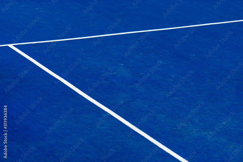Blue paddle tennis court field with white lines background