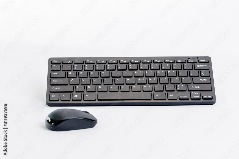 Close-up of a wireless mouse and keyboard Close-up of a wireless mouse and keyboard