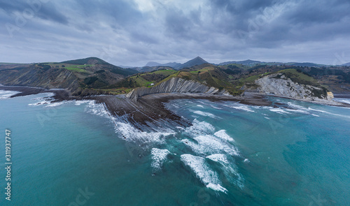 Zumaia and Deba flysch geological strata layers drone aerial view  Basque Country