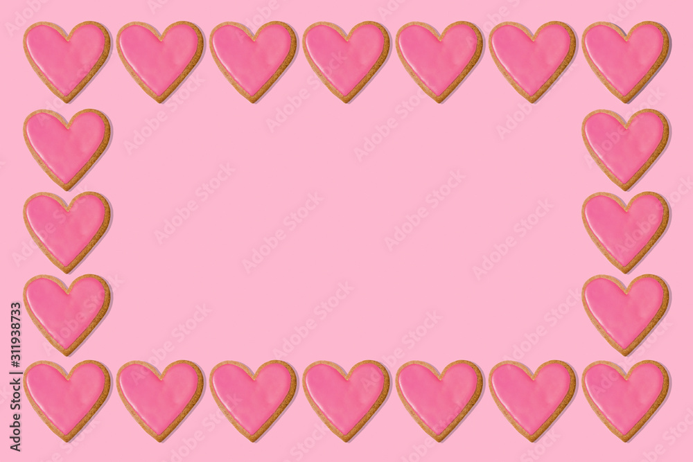 Valentine gift background. Pink heart cookie frame border. Love concept. Copy space
