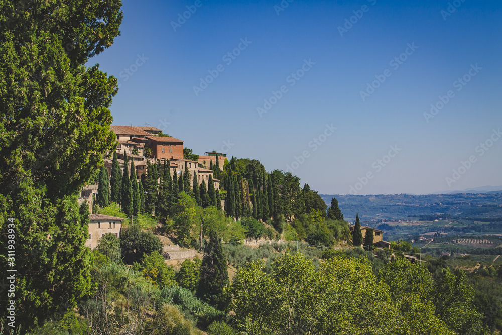 San Gimignano, Italy - 08.26.2017: landscape with the medieval city of San Gimignano in Tuscany