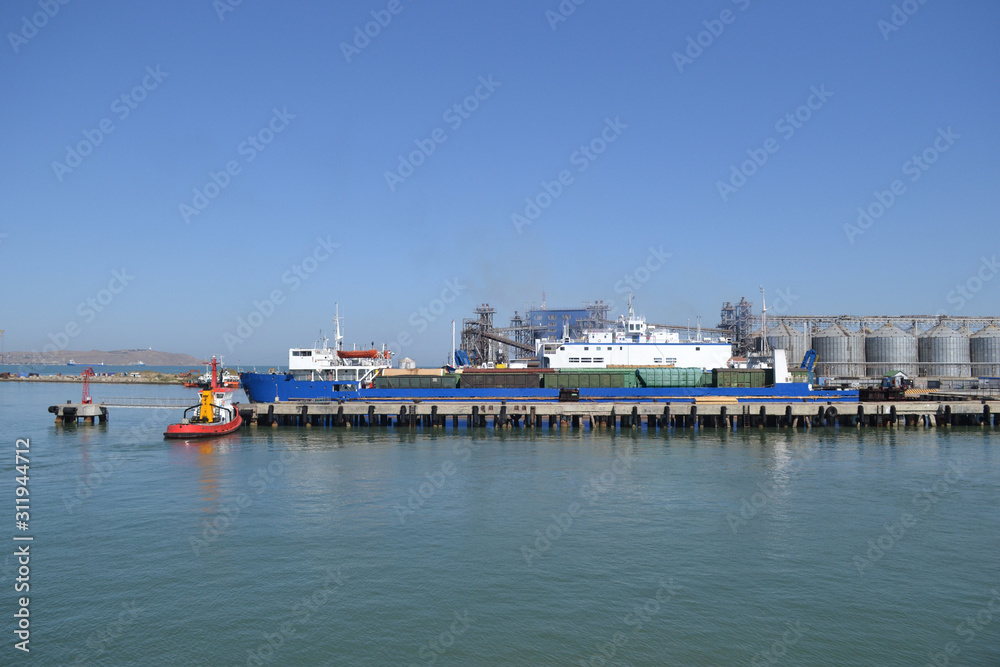 View of the cargo ferry in the Black Sea. Clear sunny day, blue sky.