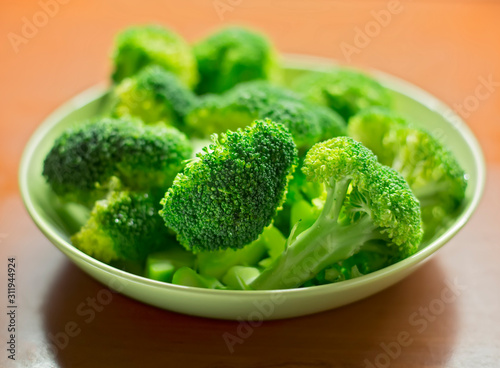 Raw green broccoli in plate
