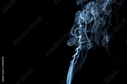 Puff of smoke on a dark background.