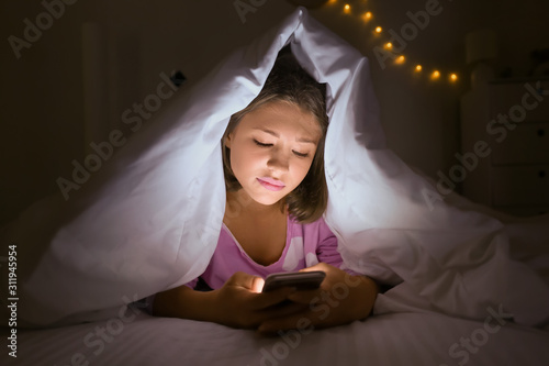 Teenage girl with mobile ph...
