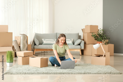 Happy young woman with lapt...