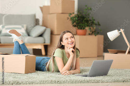 Happy young woman with lapt...