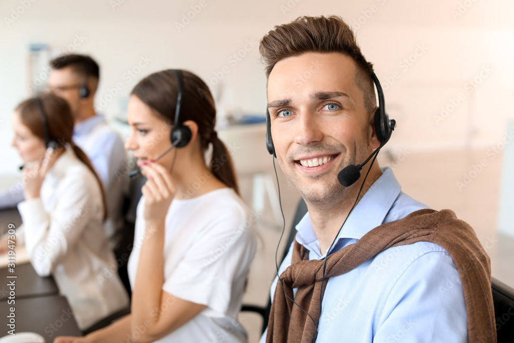 Male technical support agent working in office Male technical support agent working in office