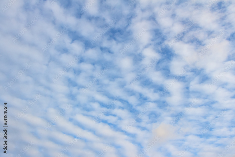 White clouds in the blue sky. Background. Texture White clouds in the blue sky. Background. Texture