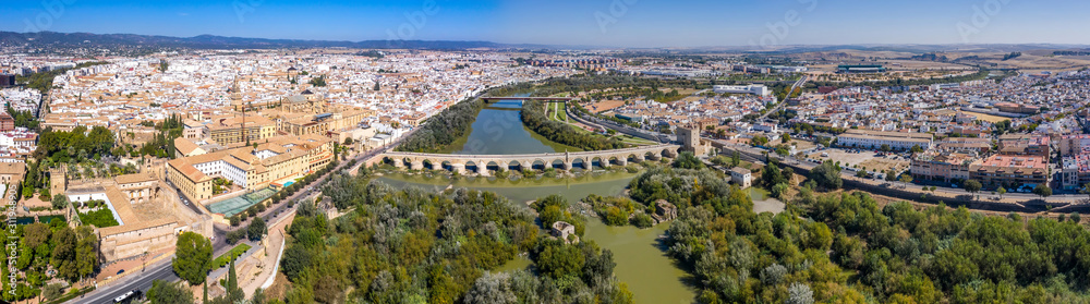 Panoramic aerial view of the Romano Bridge and the old town of Cordoba. Spain