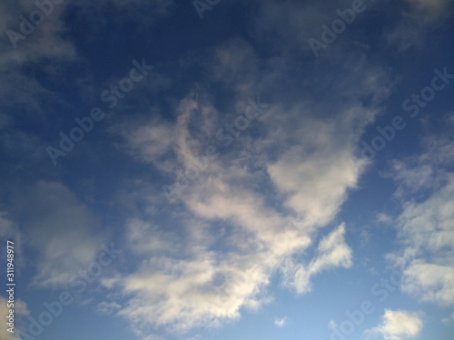 Clouds in sky, sunset, morning light through the blue photo