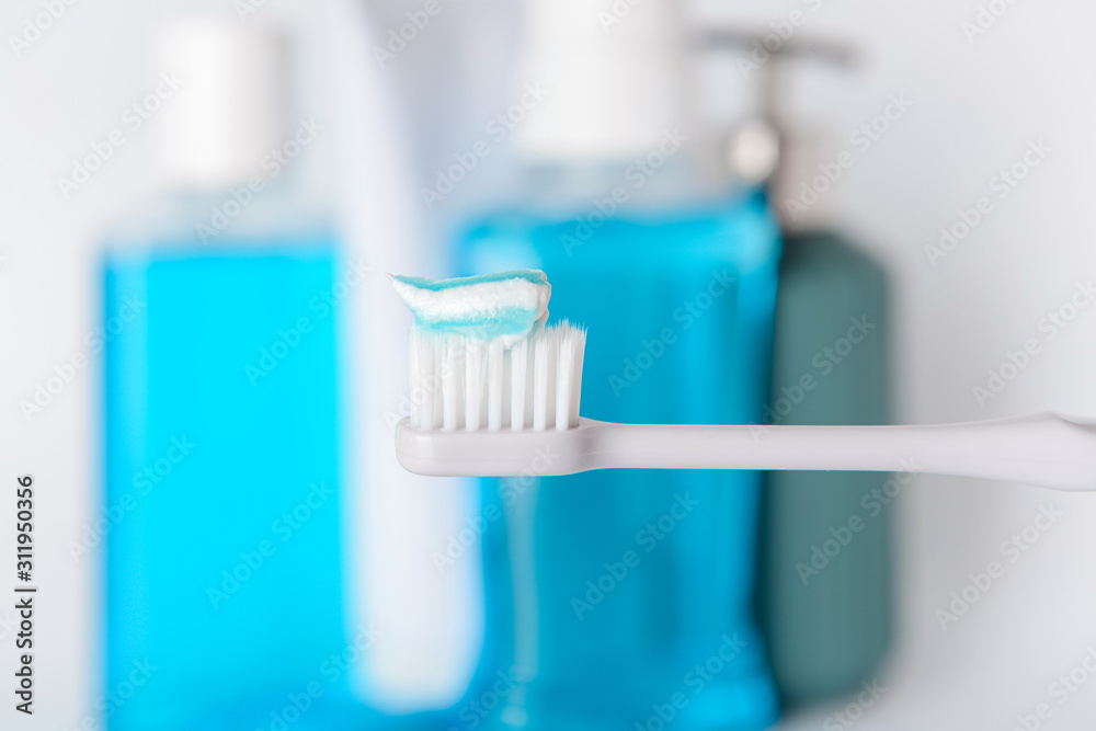 Tooth brush with paste in bathroom, closeup Tooth brush with paste in bathroom, closeup