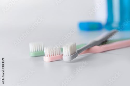 Tooth brushes on white table
