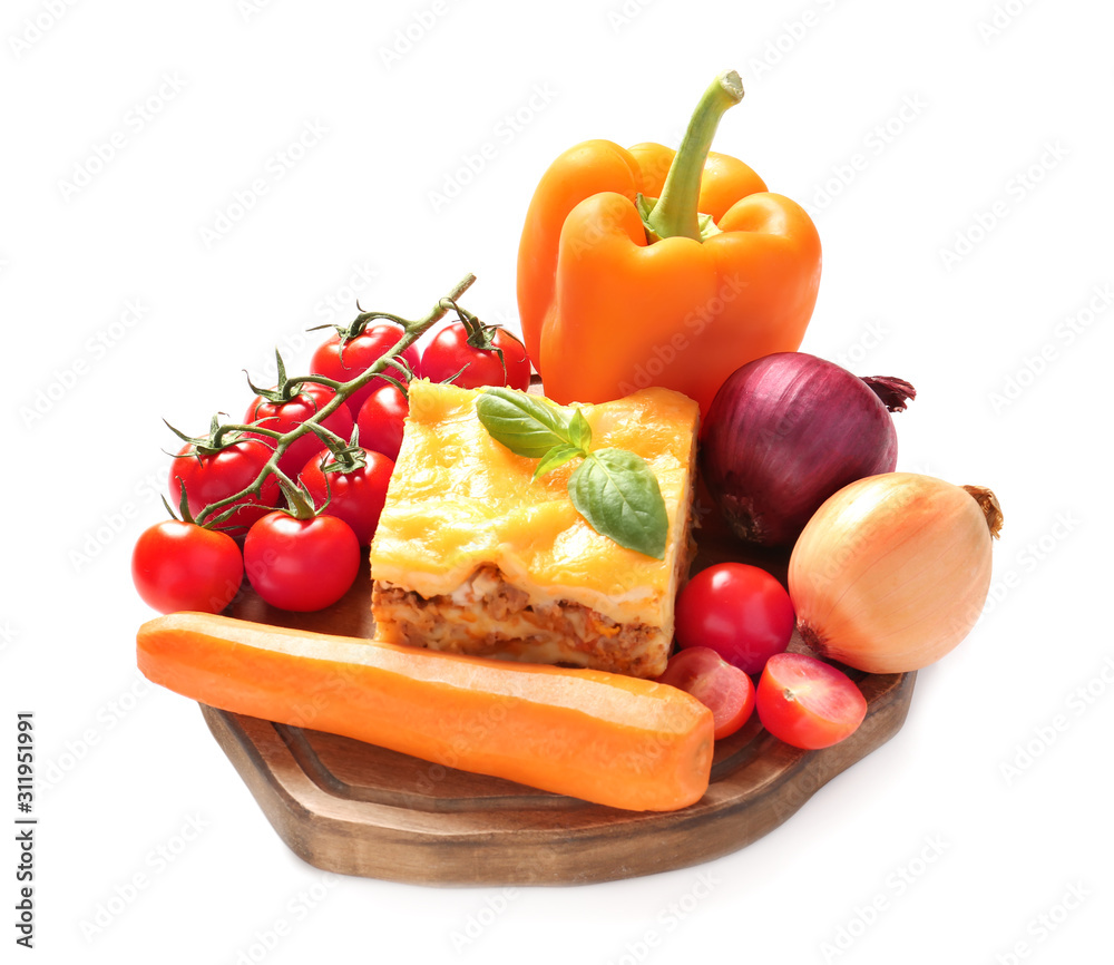 Board with prepared lasagna and fresh vegetables on white background Board with prepared lasagna and fresh vegetables on white background