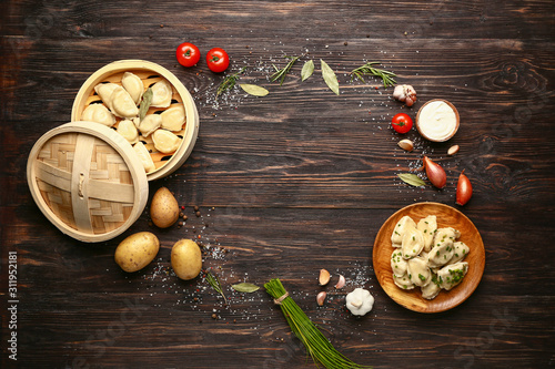 Composition with tasty dumplings and space for text on wooden background