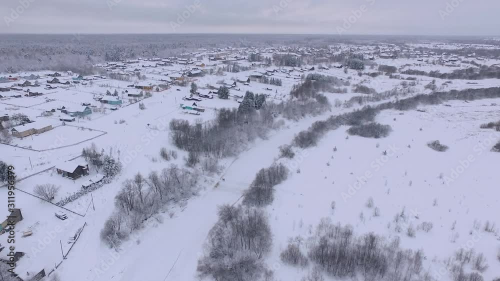 cold Northern settlement in the frosty winter shooting from the height of a drone in Russia, landscape