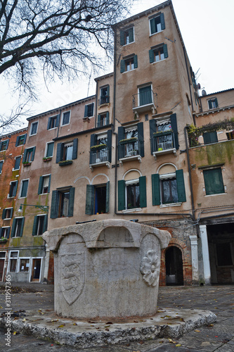 A well in front of the house facades of buildings in the jewish Ghetto in the district of Cannareggio, in Venice. 