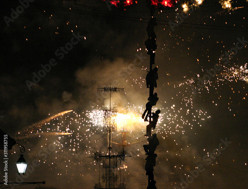 Mexicans climbing up a fireworks pole during a celebration in San Miguel de Allende. 