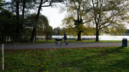 Father is walking in Treptower Park with a stroller, East Berlin