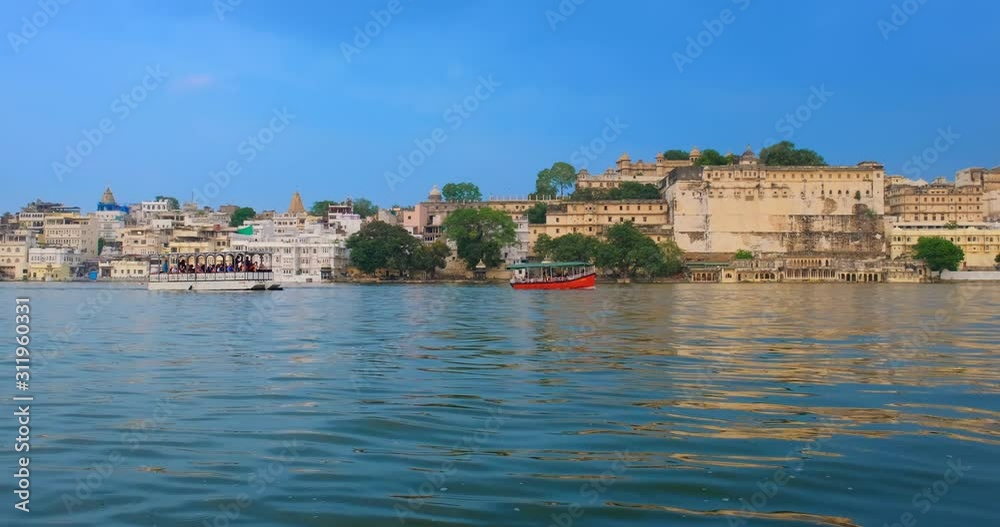 Udaipur City Palace on lake Pichola - Rajput architecture of Mewar dynasty rulers of Rajasthan. Udaipur, India. Horizontal pan Udaipur City Palace on lake Pichola - Rajput architecture of Mewar dynasty rulers of Rajasthan. Udaipur, India. Horizontal pan