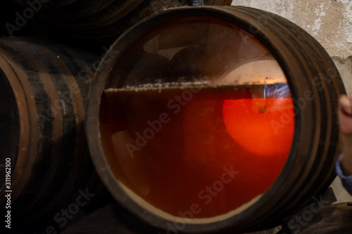 Production of fortified jerez, xeres, sherry wines in old oak barrels in sherry triangle, Jerez la Frontera, El Puerto Santa Maria and Sanlucar Barrameda Andalusia, Spain