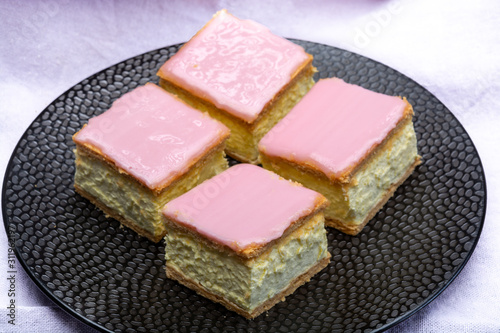 Tompoes or tompouce, iconic pastry in Netherlands and Belgium made from puff dough, icing, cream