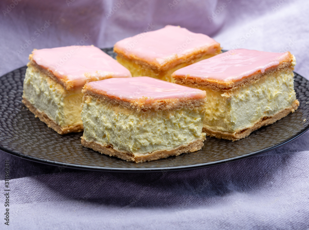 Tompoes or tompouce, iconic pastry in Netherlands and Belgium made from puff dough, icing, cream Tompoes or tompouce, iconic pastry in Netherlands and Belgium made from puff dough, icing, cream