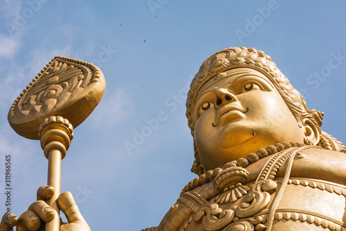 Photography Top of statue of Murugan at the Batu caves in Kuala Lumpur.