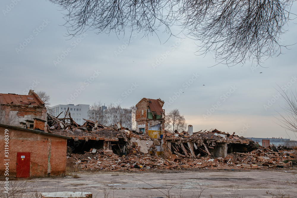 Remains of demolished old industrial building. Pile of stones, bricks and debris Remains of demolished old industrial building. Pile of stones, bricks and debris