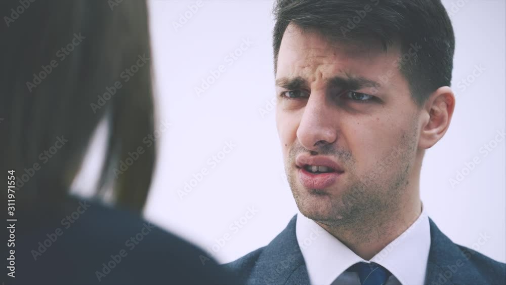 Boss is shouting at her secretary, speaking loudly, pointing out her fault. Boss is shouting at her secretary, speaking loudly, pointing out her fault.