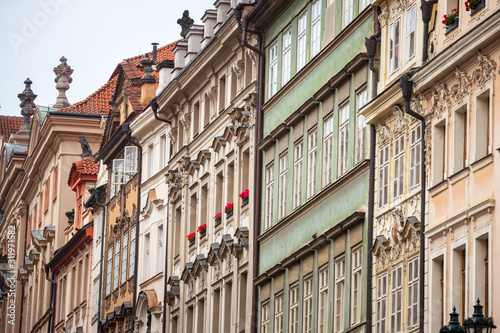 Typical Medieval Facade of an old appartment residential building in a street of old town, the historical center of Prague, Czech Republic, in the most touristic part of the city © Jerome