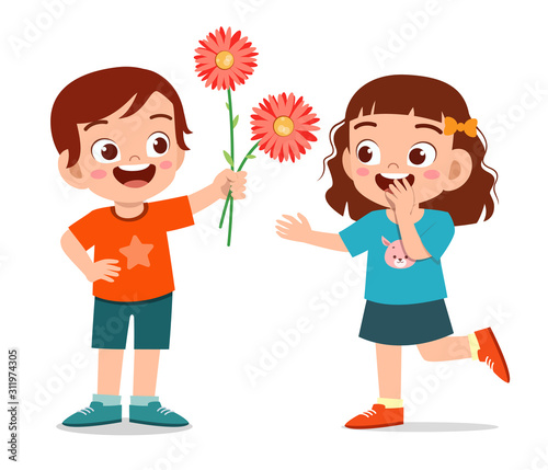 happy cute kid boy give flower to friend