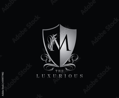 Luxury Guard M Letter Logo Icon. Silver M With Classy Shield Shape design perfect for fashion, Jewelry, Beauty Salon, Cosmetics, Spa, Hotel and Restaurant Logo. 