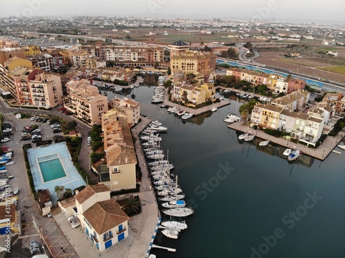 Aerial view of the marina of La Pobla de Farnals, Valencia, Spain. Boats moored in the harbor, great landscape view of the Valencia City photo