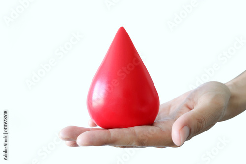 Hand of a healthy man hold symbol blood.Help and Health Concepts