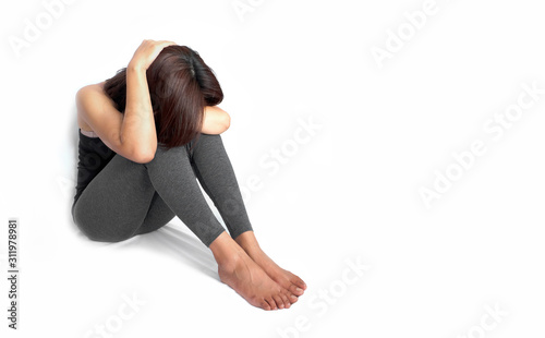 Female sitting depression in the corner of strained unhappy .