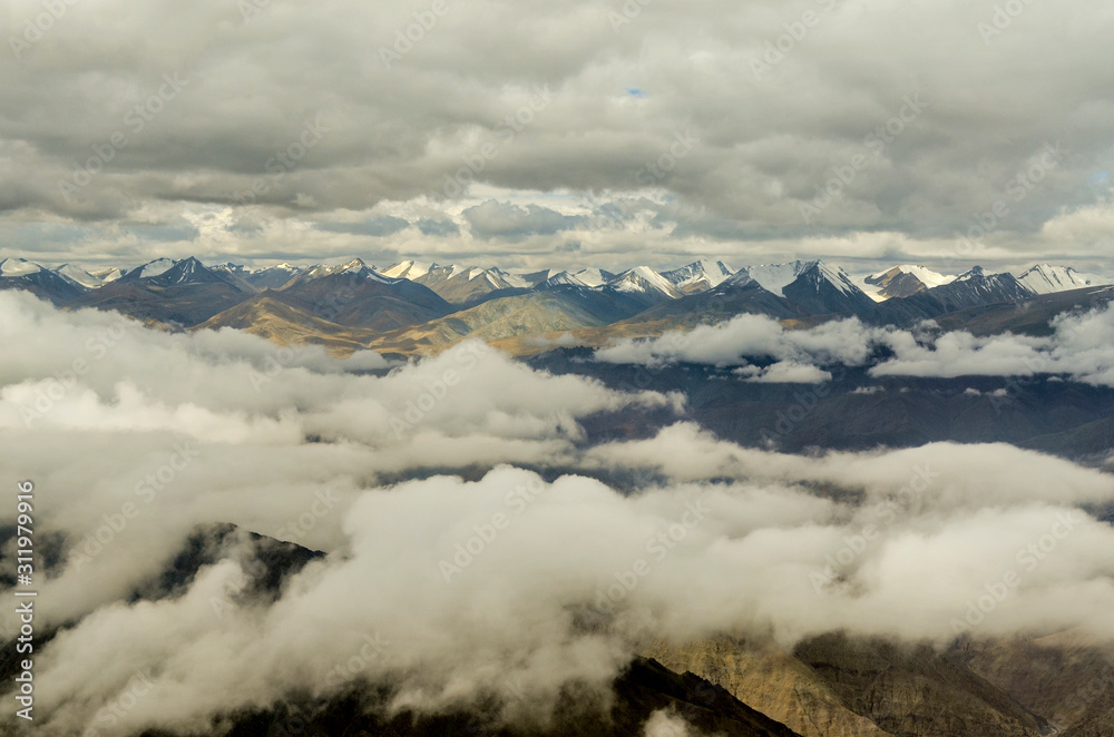 Arial view Snow peaks of himalayas from Flight window, Ladakh, India, Asia