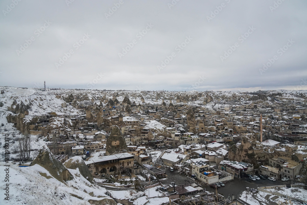Cappadocia / Turkey - December 10 2019: top view of Cappadocia city covered with first snow in winter