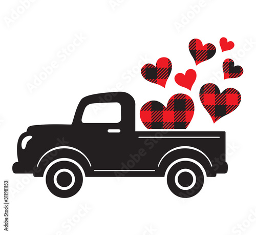 Vector illustration of a vintage truck carrying valentine heart. Plaid buffalo pattern hearts. © JungleOutThere