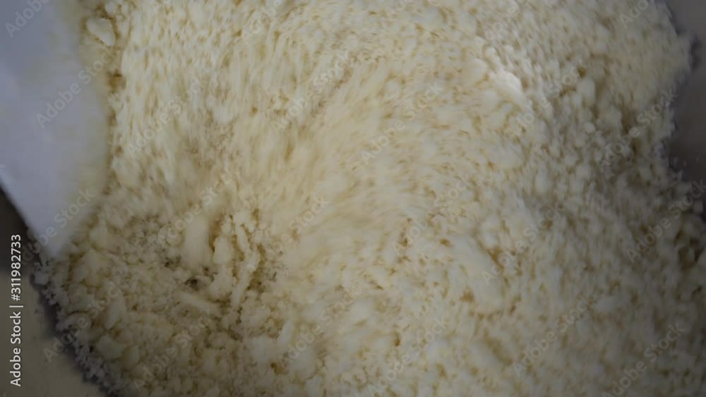 home baking: mixing flour, with butter and cream home baking: mixing flour, with butter and cream