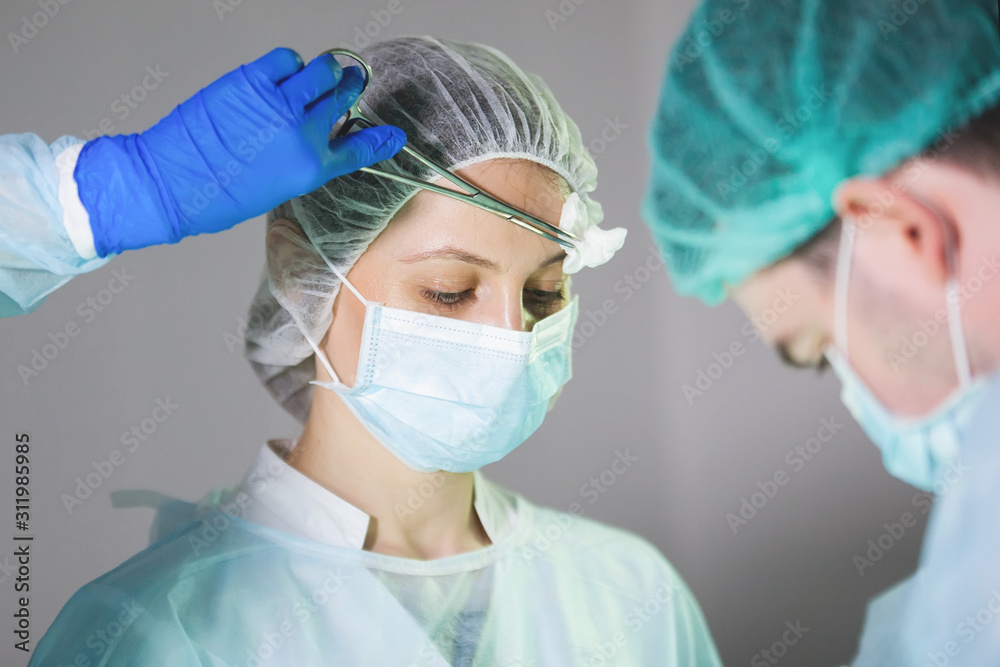 Nurse in a cap and mask. Nurse in a cap and mask.
