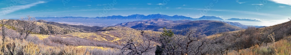 Fototapeta premium Views of Wasatch Front Rocky Mountains from the Oquirrh Mountains with fall leaves, Hiking in Yellow Fork trail and Rose Canyon in Great Salt Lake Valley. Utah, United States. USA.