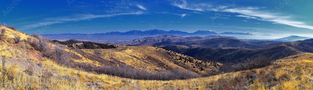Fototapeta premium Views of Wasatch Front Rocky Mountains from the Oquirrh Mountains with fall leaves, Hiking in Yellow Fork trail and Rose Canyon in Great Salt Lake Valley. Utah, United States. USA.