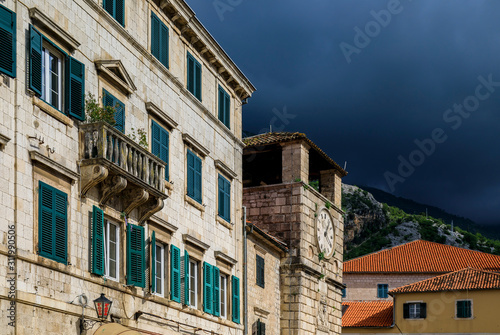 Picturesque brick walls of houses and City Tower in the Old town of Kotor Montenegro in the Balkans on the Adriatic Sea