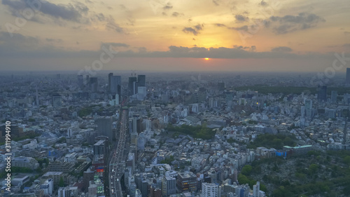 route 3 shuto expressway from mori tower as sun sinks beneath clouds in tokyo © chris