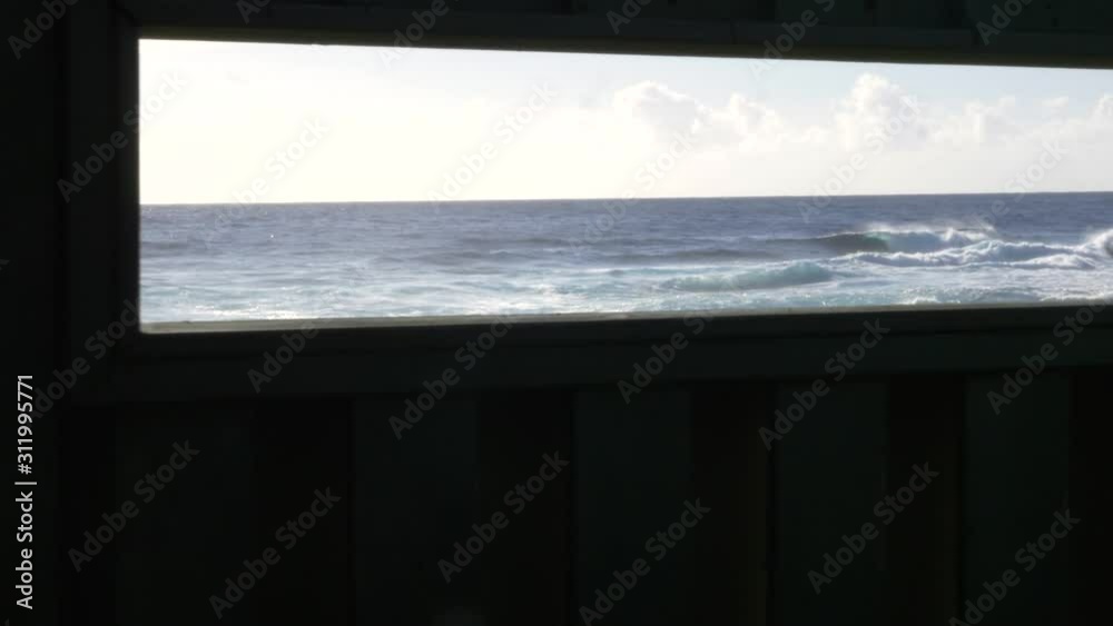 ocean reveal through window slide right past columns at Whittington beach ocean reveal through window slide right past columns at Whittington beach