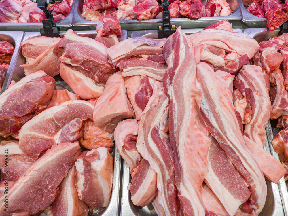 Fresh raw pork chop meat in supermarket
