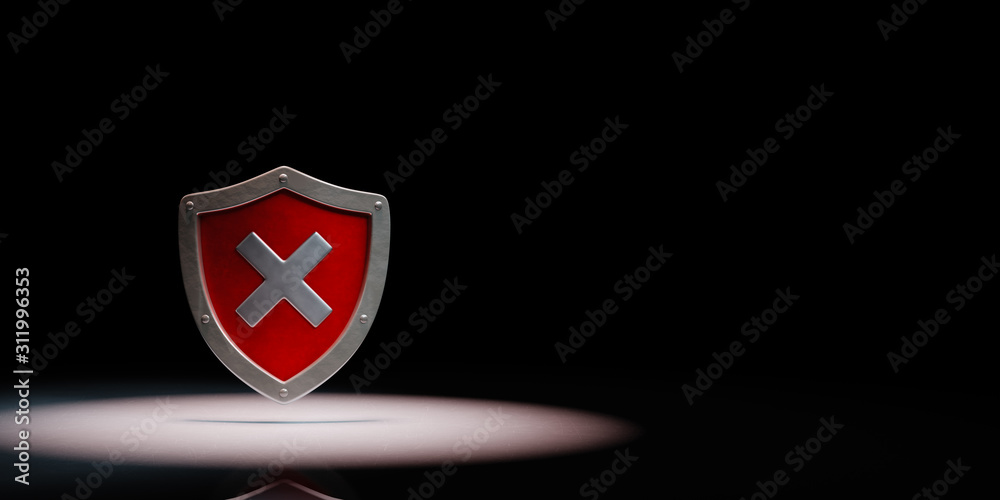 Metallic Shield Shape with Cross Spotlighted on Black Background Metallic Shield Shape with Cross Spotlighted on Black Background