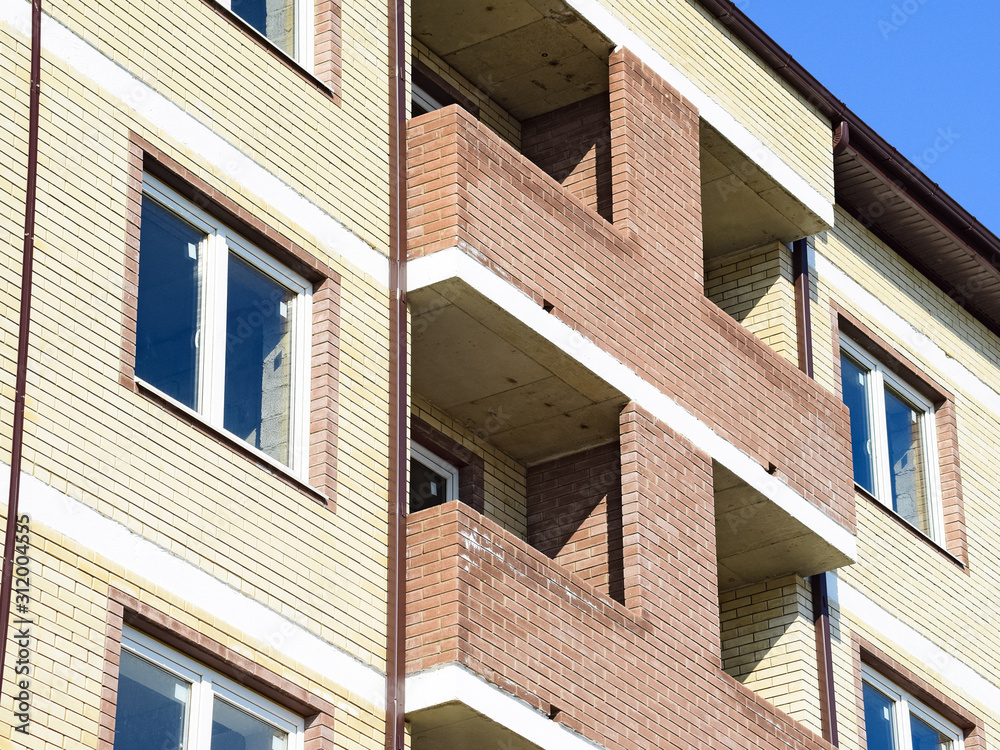 Balconies and windows of a multi-storey new house Balconies and windows of a multi-storey new house